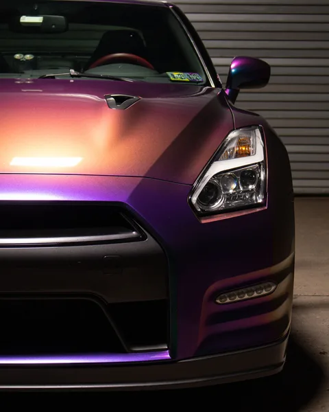 Color-shift GT-R front quarter detail showing purple to gold transition
