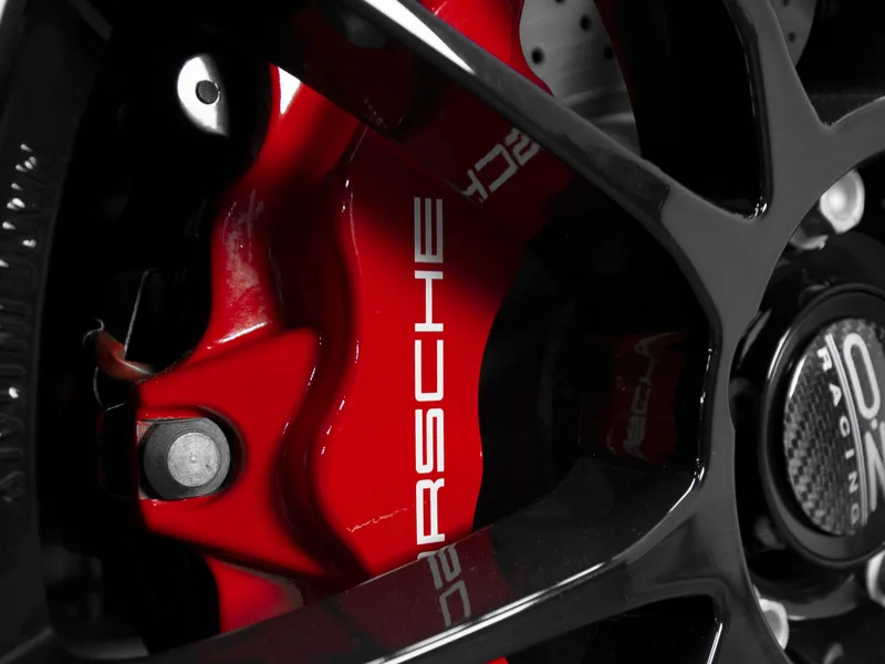 Powder coated Porsche brake caliper in red