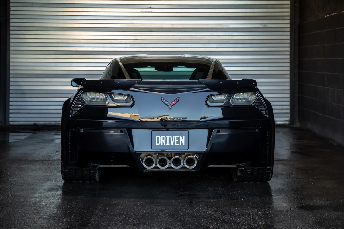 Black Corvette Z06 rear view with DRIVEN plate - PPF protected