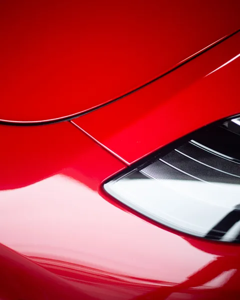 Red Tesla hood and headlight detail