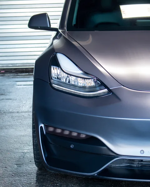 Gray Tesla Model 3 headlight with PPF