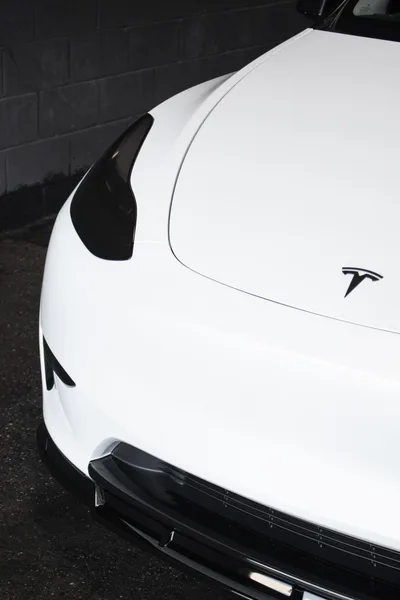 White Tesla Model Y rear badge and taillight