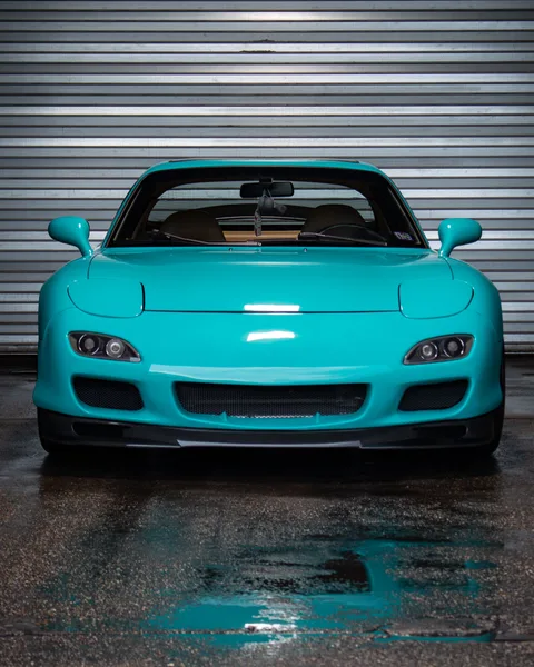 Full body teal vinyl wrap on Mazda RX-7 at Driven Auto Styling Philadelphia